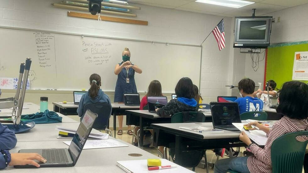 Teacher leading American Sign Language Class