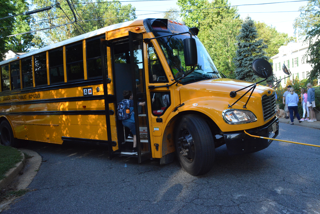 Student getting on a school bus.