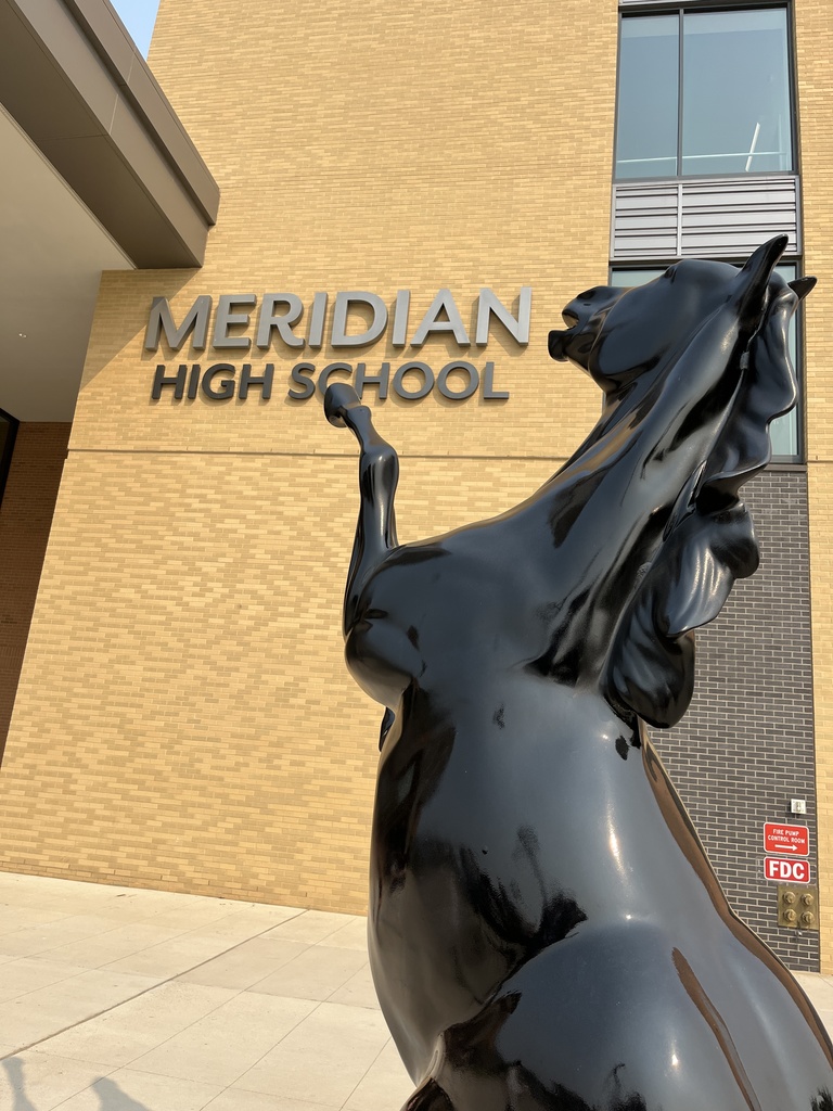 MERIDIAN HIGH SCHOOL exterior sign and Mustang statue.