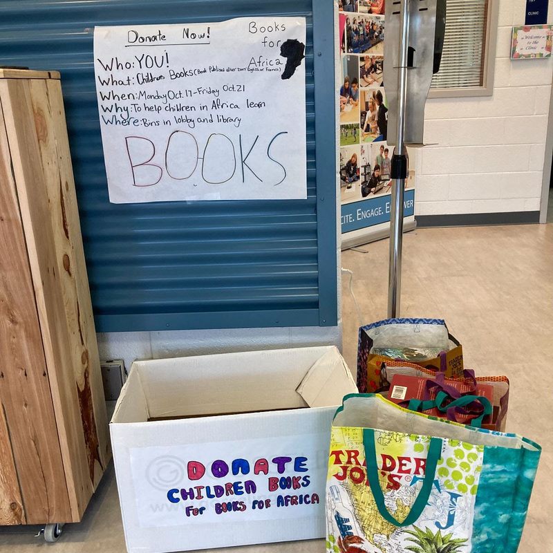 Box and bags to collect books donated to the Book Drive